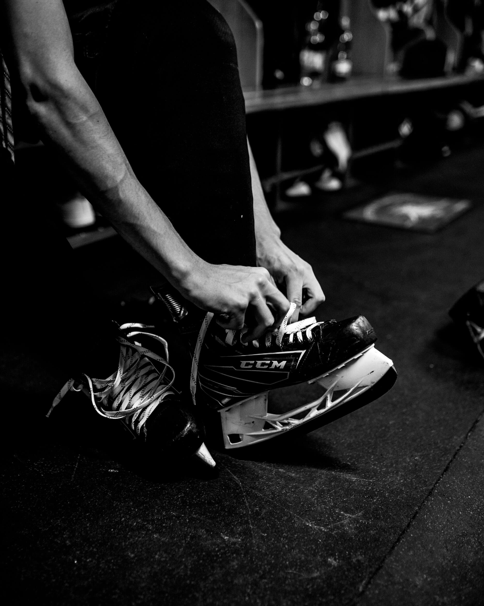 Hockey player lacing up - stock