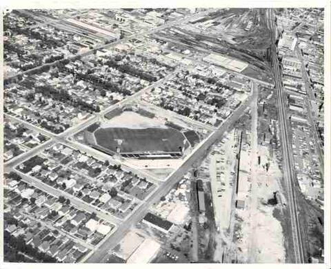Aerial view of urban neighborhood with stadium.