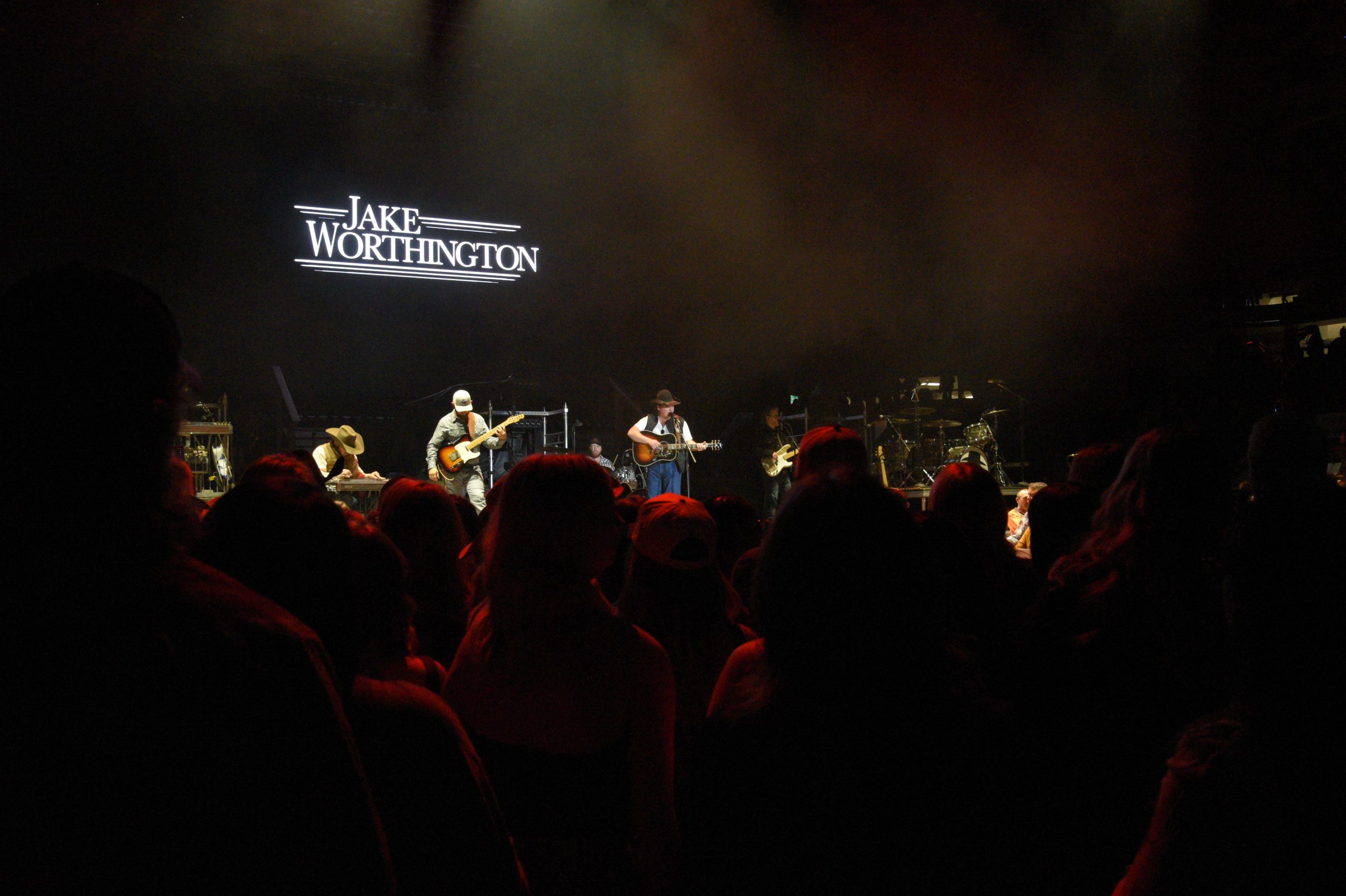 Country band performing live on stage.
