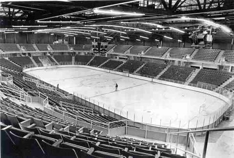 Empty indoor ice hockey rink arena view.