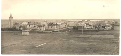 Historic town panoramic view with church and buildings.