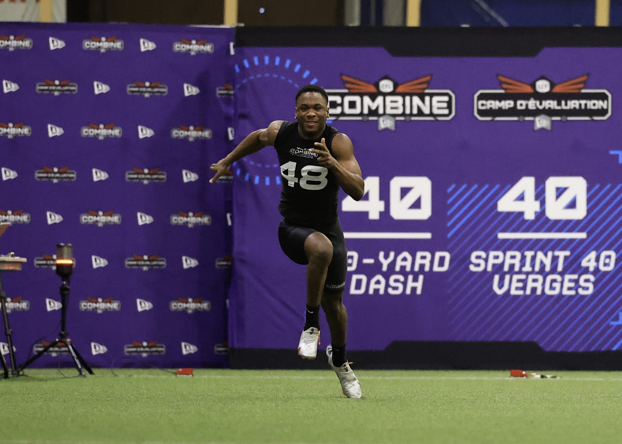Athlete sprinting during 40-yard dash at combine.