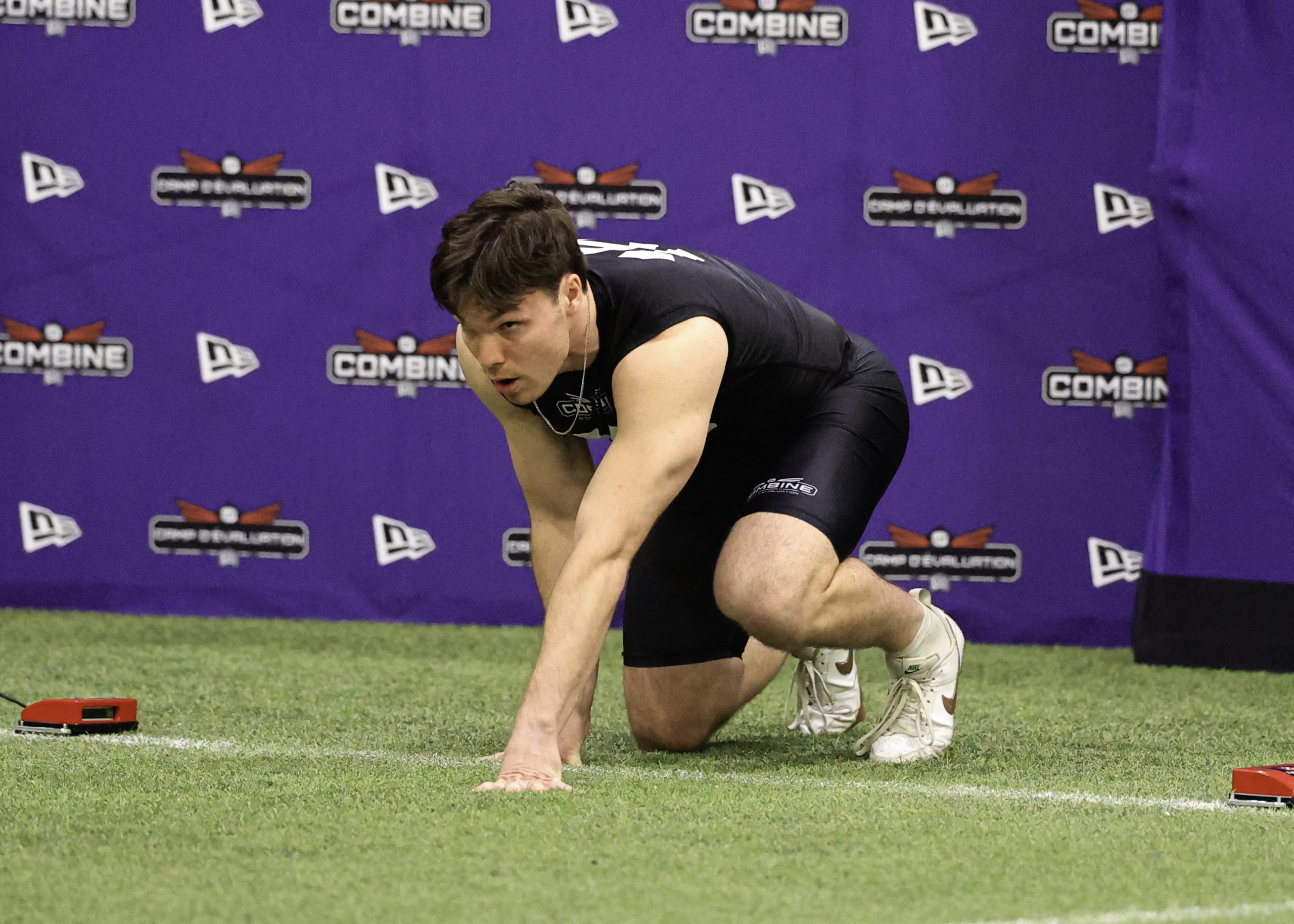 Athlete in starting position at combine event.