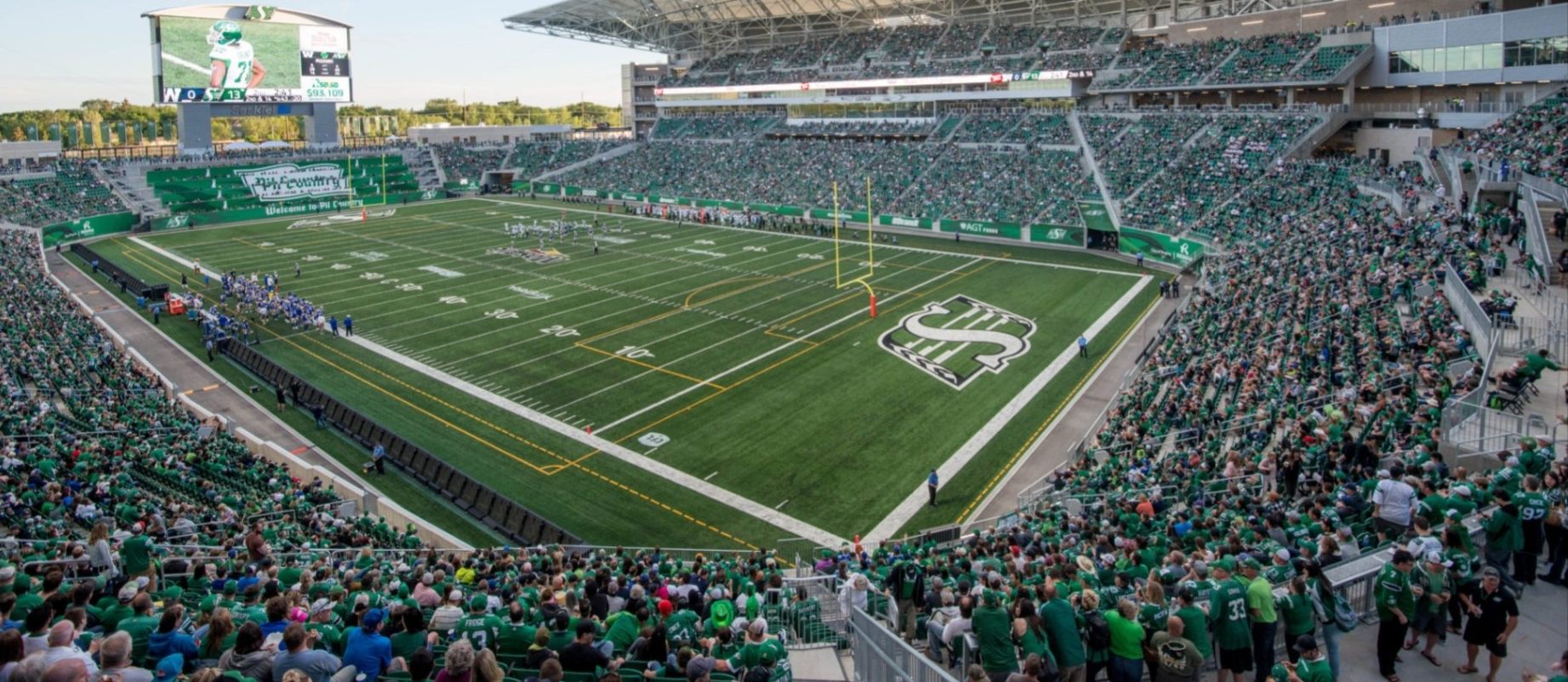 Saskatchewan Roughriders CFL football game at packed Mosaic Stadium.