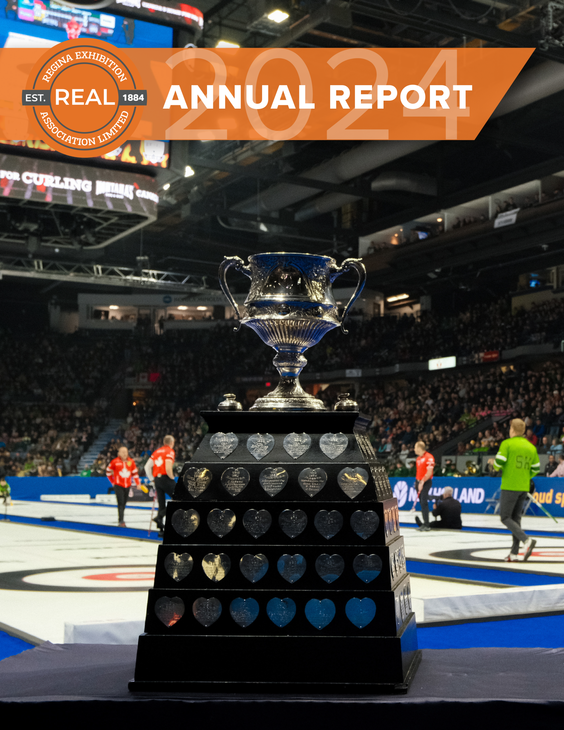 Curling championship trophy on display in arena.