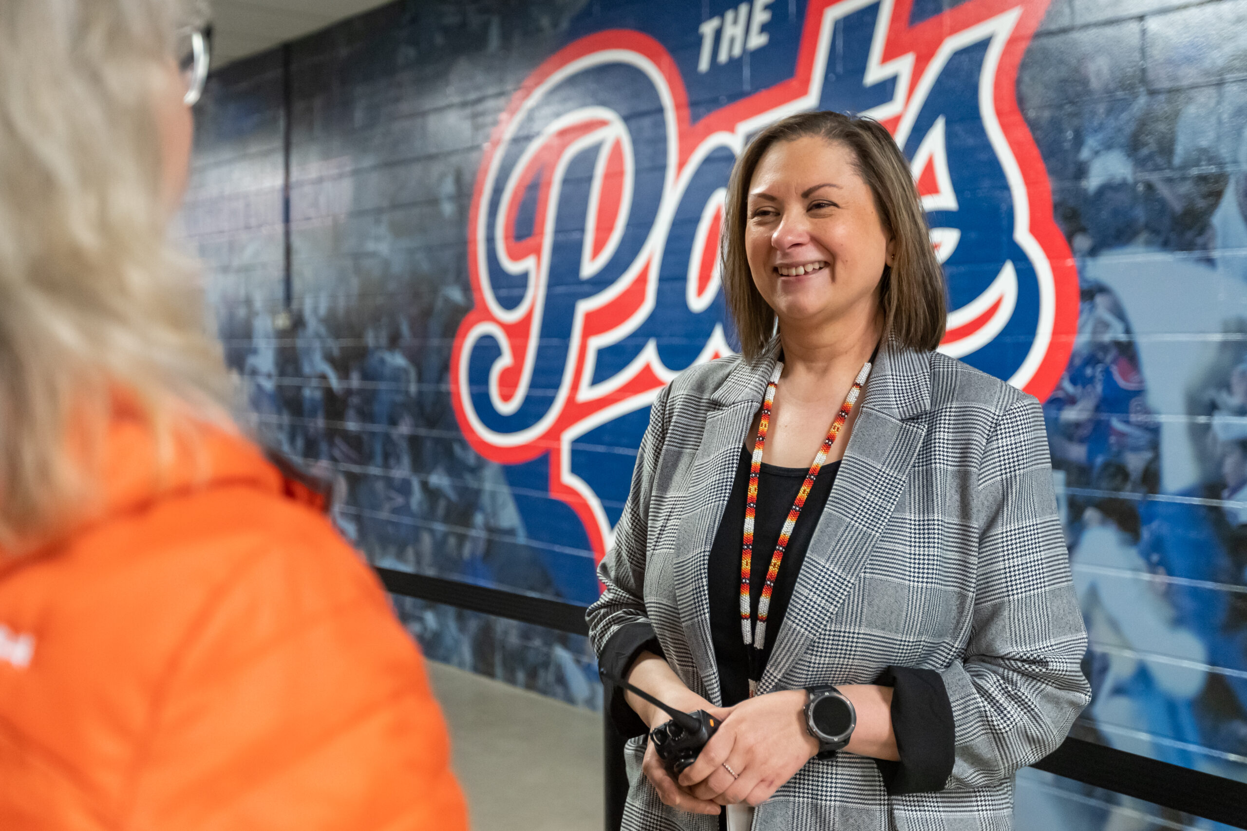 Woman smiling at sports stadium wall art