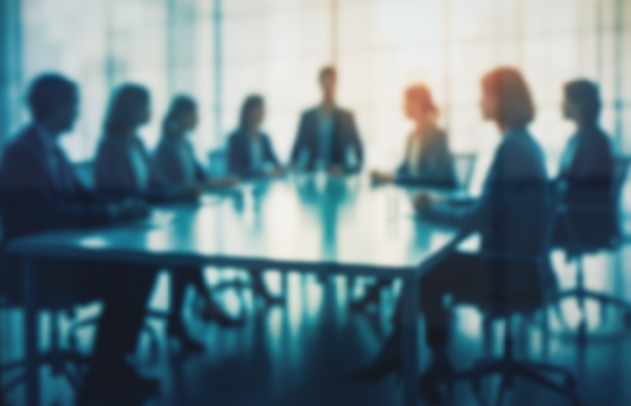 Blurry business meeting at boardroom table